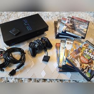 Playstation 2 Console with Controller, 8MB memory card, and 8 games.